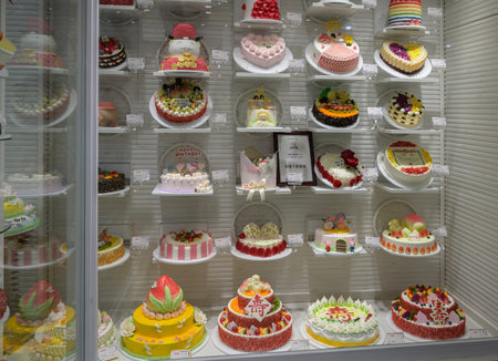 MISHAN, CHINA - JULY 28, 2019: Various baked products at chinese shop. Selective focus.のeditorial素材