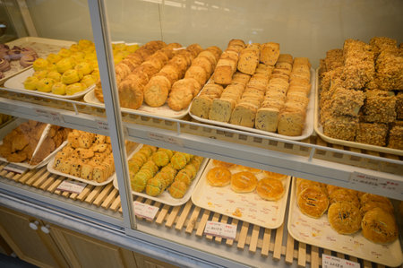 MISHAN, CHINA - JULY 28, 2019: Various baked products at chinese shop. Selective focus.のeditorial素材