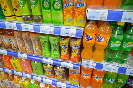 MISHAN, CHINA - JULY 28, 2019: Various drinks at chinese shop. Selective focus.のeditorial素材