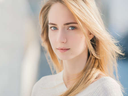 Portrait of a beautiful young woman with blue eyes.の写真素材