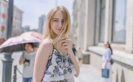 Outdoors portrait of beautiful young woman. Selective focus.の写真素材