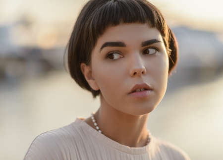 Attractive young woman at sunset.