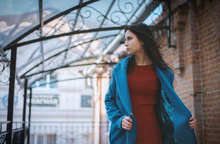 Portrait of beautiful young woman in coat.の写真素材