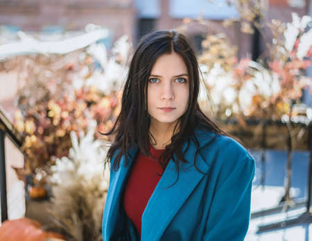Portrait of beautiful young woman in coat.の写真素材