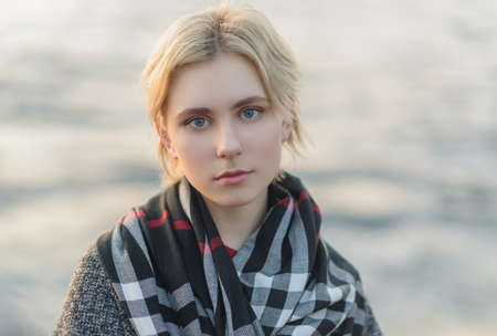 Outdoors portrait of beautiful young woman. Selective focus.の写真素材