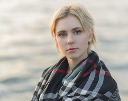 Outdoors portrait of beautiful young woman. Selective focus.