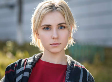 Outdoors portrait of beautiful young woman. Selective focus.の写真素材