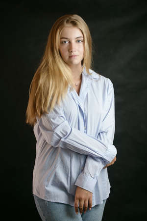 Portrait of beautiful sensual woman with blue eyes. Studio shot.の写真素材