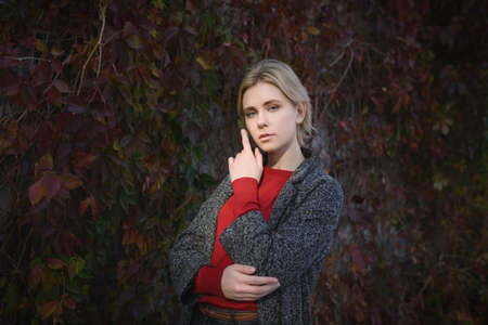 Outdoors portrait of beautiful young woman. Selective focus.の写真素材