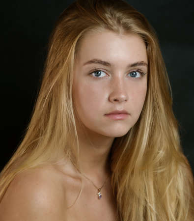Portrait of beautiful sensual woman with blue eyes. Studio shot.の写真素材