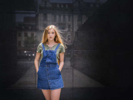 Outdoors portrait of beautiful young woman with blue eyes.の写真素材