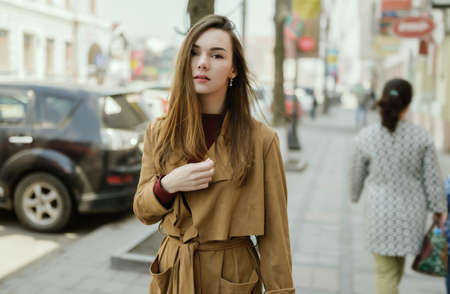 Woman in vintage cloak at street.の写真素材