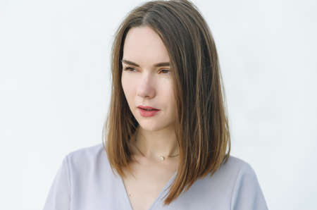 Portrait of pensive young woman.