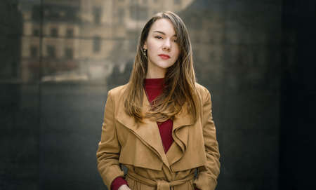 Woman in vintage cloak at street.