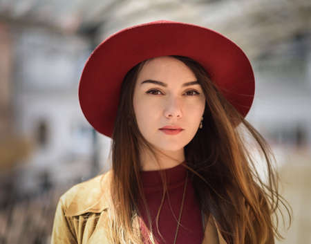 Woman in vintage cloak and red hat.の写真素材
