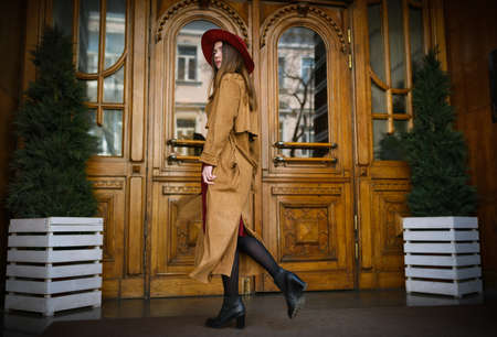 Woman in vintage cloak and red hat.の写真素材