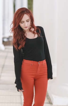 Portrait of attractive red haired young woman with blue eyes.の写真素材