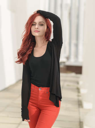 Portrait of attractive red haired young woman with blue eyes.の写真素材