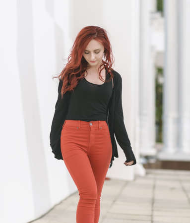 Portrait of attractive red haired young woman with blue eyes.の写真素材