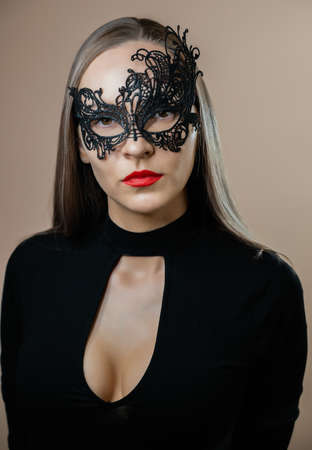 Close-up of woman face in carnival mask. Selective focus.の写真素材