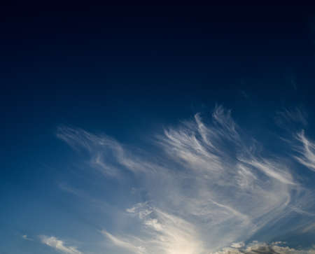 Dramatic sunset sky with light clouds.の写真素材