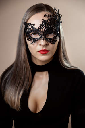Close-up of woman face in carnival mask. Selective focus.の写真素材