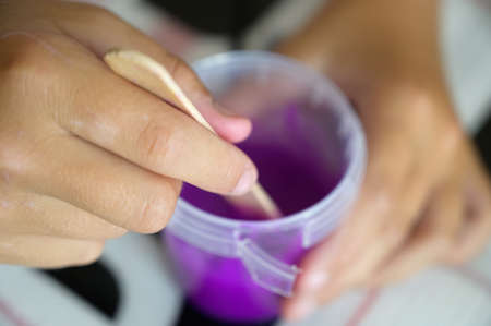 Little girl makes a homemade slime. Selective focus.の写真素材