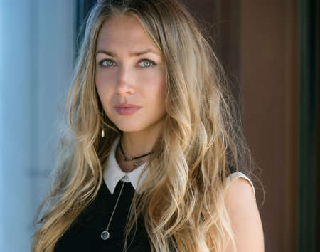 Outdoors portrait of beautiful young woman. Selective focus.の写真素材