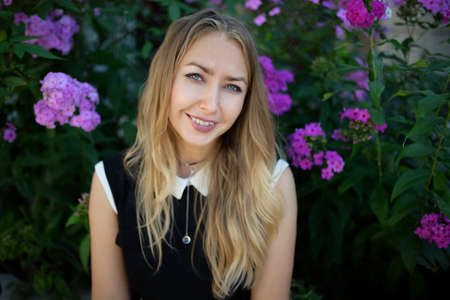 Outdoors portrait of beautiful woman with green eyes.の写真素材