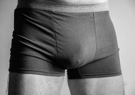 Young man in boxer underpants. Selective focus.の写真素材