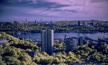 Cityscape - view of the city at cloudly day. Photo with IR fillter.の写真素材