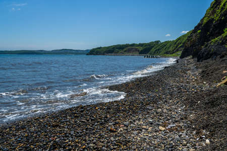 Waves at the seashore. Selective focus with shallow depth of field.の写真素材