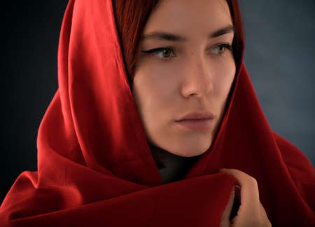 Young woman wearing hijab on black.の写真素材