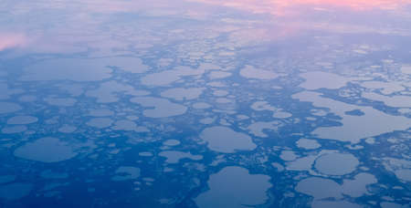 View from airplane on Earth surface - a group of small lakes.の写真素材