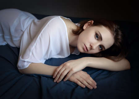 Portrait of a beautiful young woman with blue eyes.の写真素材