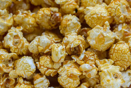 Popcorn with caramel - food background. Selective focus.の写真素材