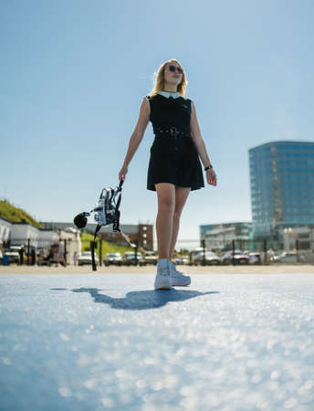 Woman in dress enjoys sun in summertime.の写真素材