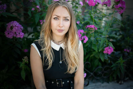 Outdoors portrait of beautiful woman with green eyes.の写真素材