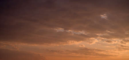 Beautiful colorful sky with clouds and sunlight. Color toned.の写真素材