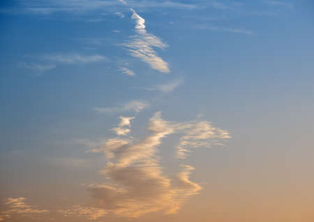Dramatic sunset sky with colored clouds. Toned image.の写真素材