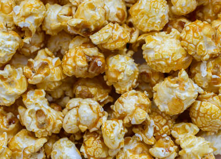 Popcorn with caramel - food background. Selective focus.の写真素材