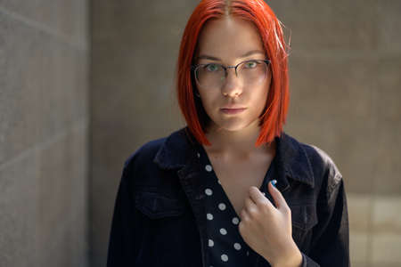 Portrait of beautiful redhead woman wearing glasses.の写真素材