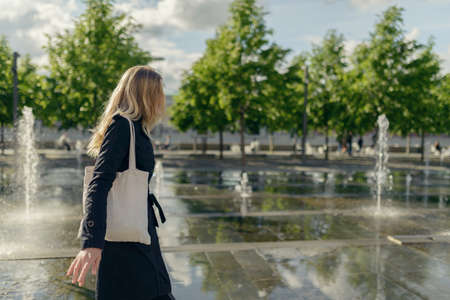 Young woman enjoys the spring sun.の写真素材