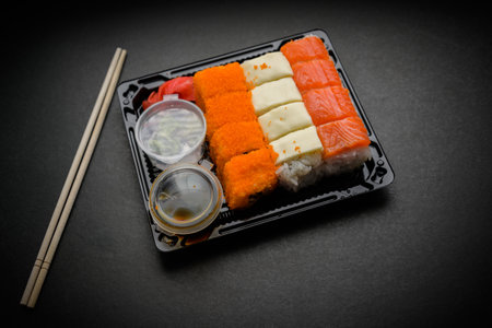 Set of various rolls in black plastic box.の写真素材