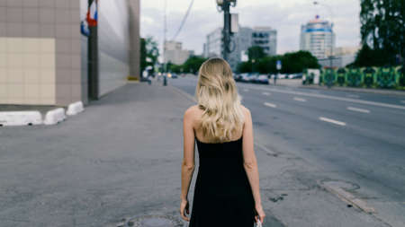 Portrait of beautiful young woman - she run down the street.の写真素材