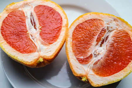 Half of fresh grapefruit. Selective focus.の写真素材