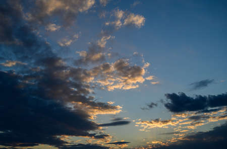 Sunset sky with orange clouds. nature background.の写真素材