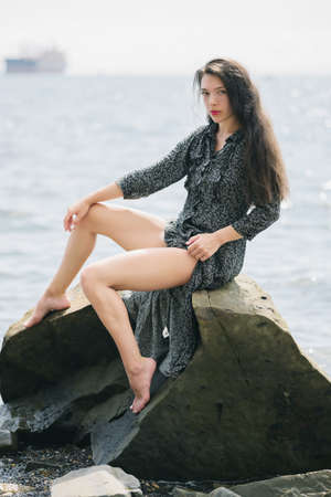 Beautiful adult woman enjoy the sea on a sunny day.の写真素材