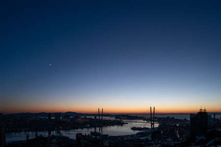 Crescent moon and venus in the dark evening sky.の写真素材