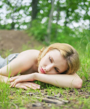 Beautiful blonde woman enjoy the forest.の写真素材